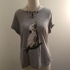 An APT.9 shirt size large with bird on front